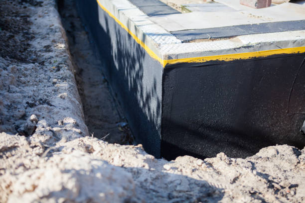 Professional Waterproofing technician working in Painesville, OH